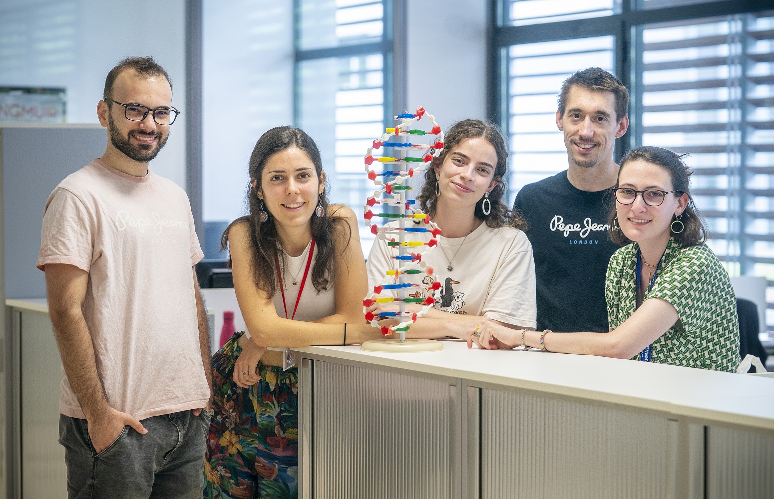 ArchaeoBiomiCs team with a DNA model in the laboratory